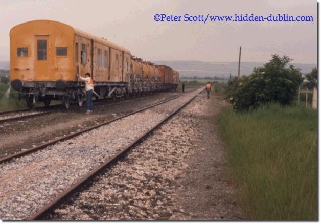 Train crew attend to the weedsprayer at Ballinacourty, June 1987, picture copyright Peter Scott