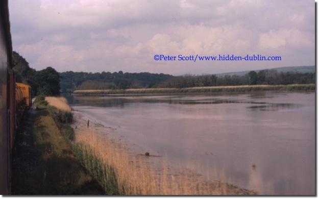 159 trundles down the Dungarvan rail line, June 1987, on the south bank of the River Suir, picture copyright Peter Scott