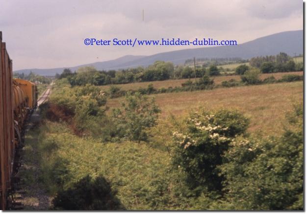 Between Kilmacthomas and Dungarvan, the Comeragh mountains can be seen from this passing train, copyright Peter Scott